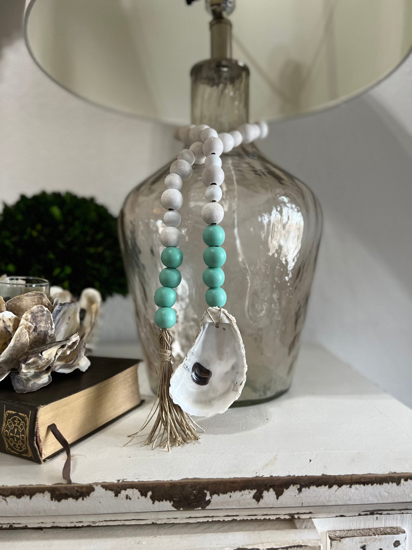 Oyster prayer beads with twine tassel