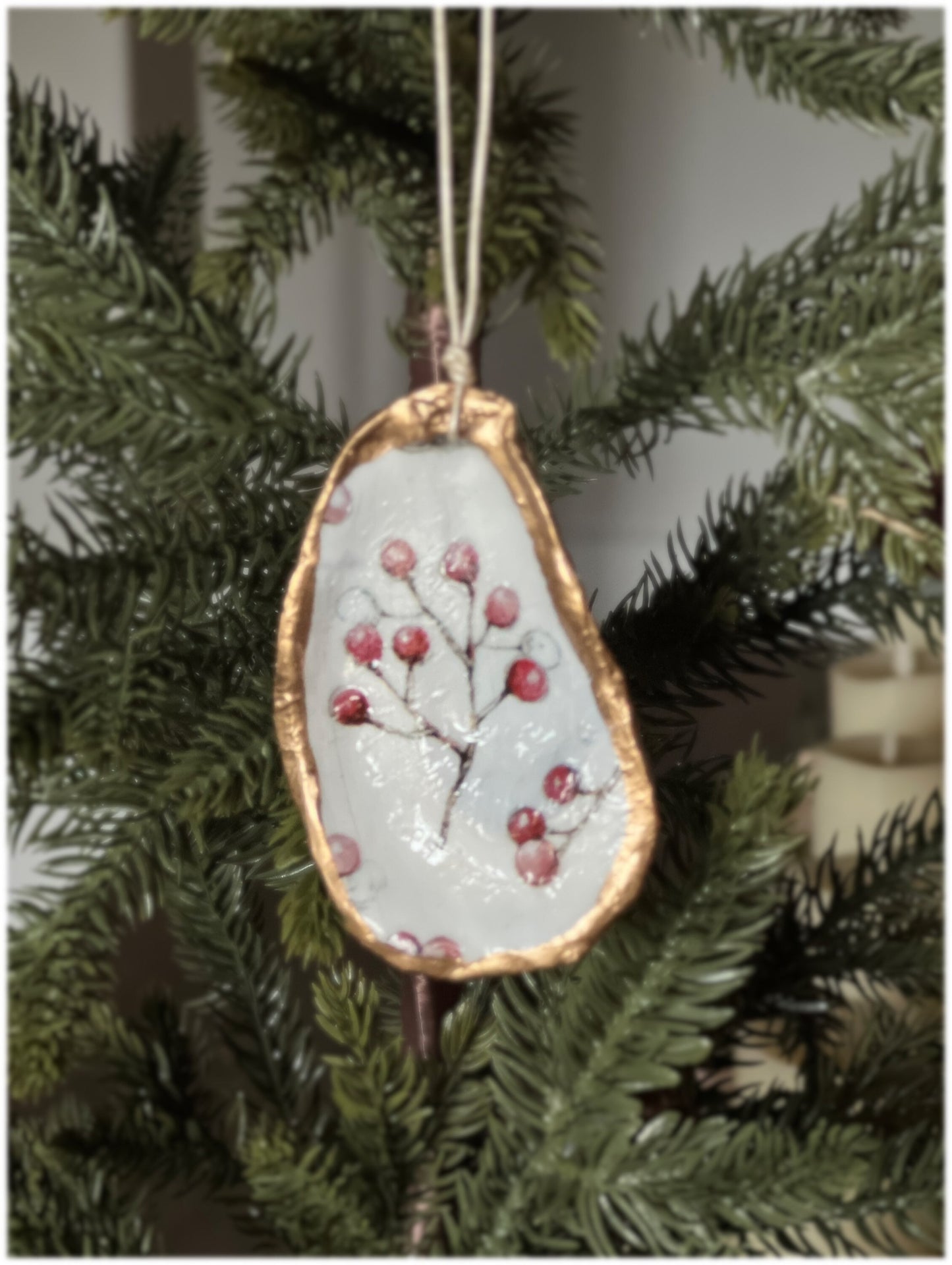 Decoupaged and gilded oyster shell ornament