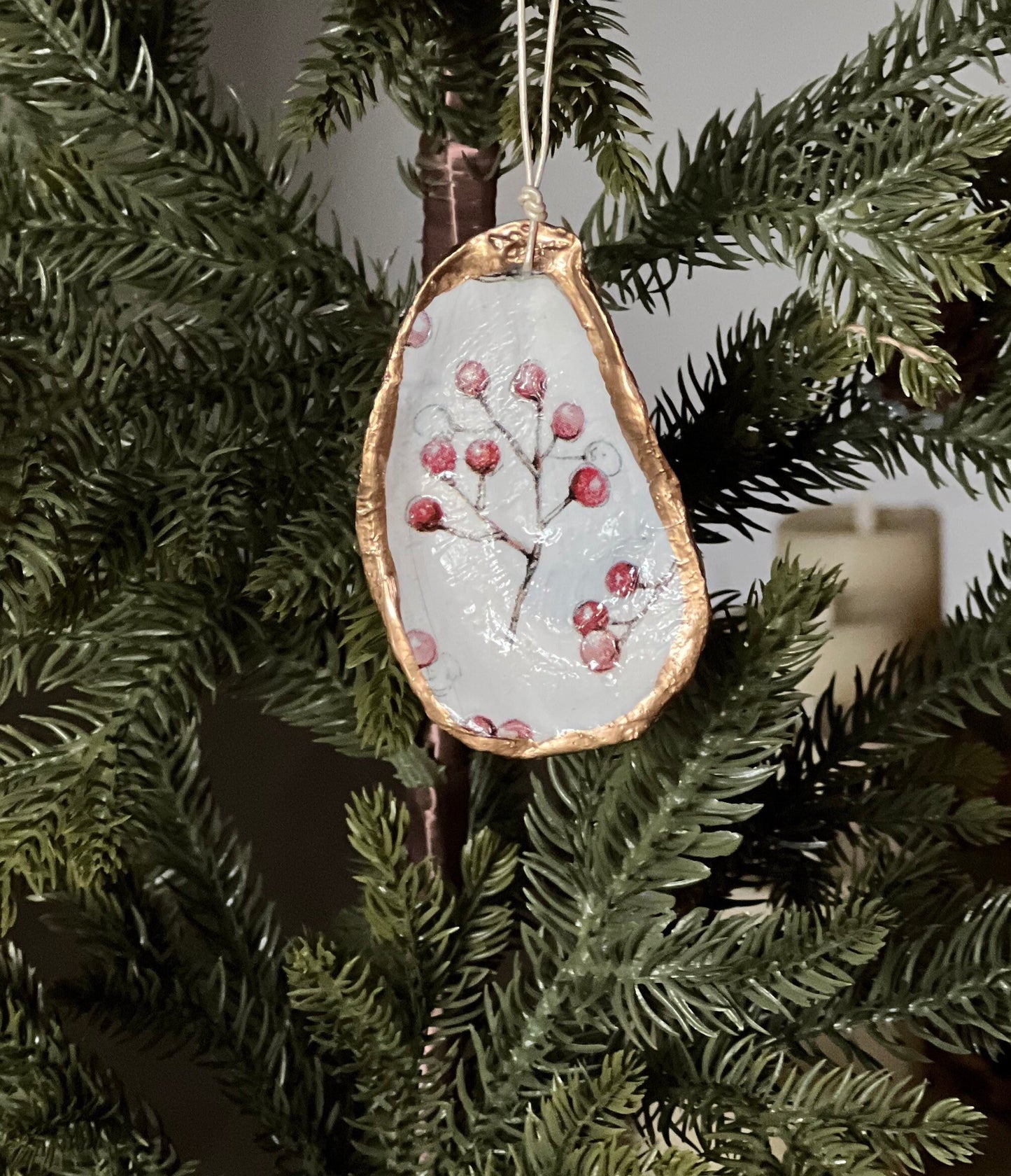 Decoupaged and gilded oyster shell ornament