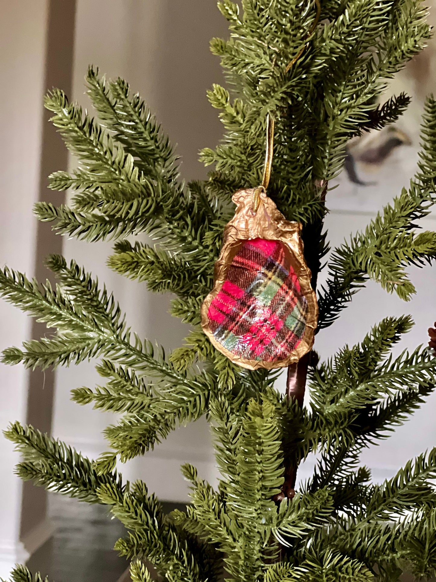 Decoupaged and gilded oyster shell ornament